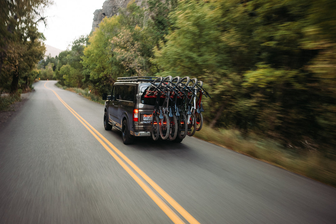 van with loaded bike rack for 6 bikes